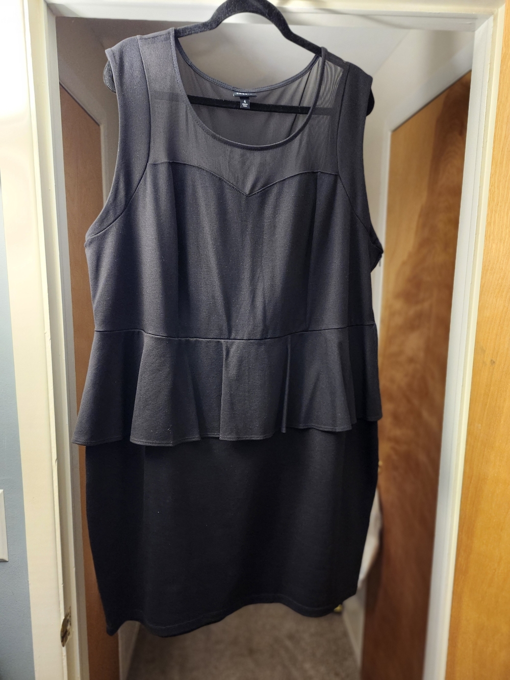 Torrid Size 4. Sleeveless Black Peplum Knit Dress